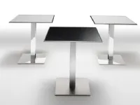 Plano Table by Infiniti with laminate top and chromed steel base.