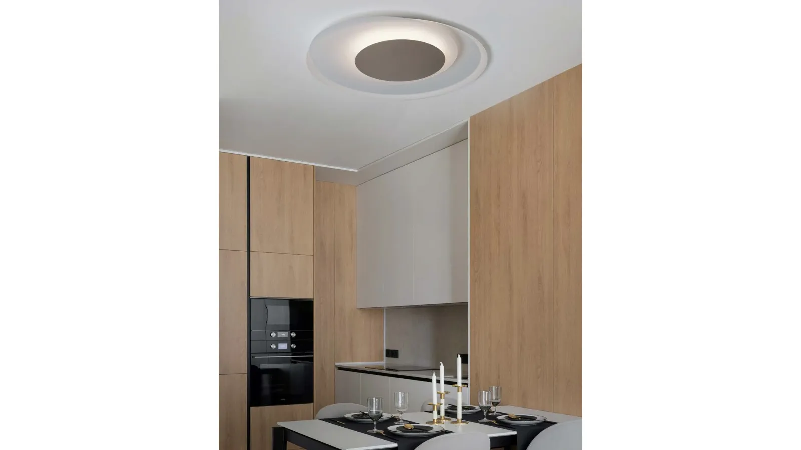 Cleo ceiling lamp in curved metal by Cattaneo.