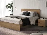Bed with Prime headboard by Spagnol Mobili.