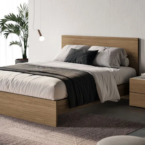 Bed with Prime headboard by Spagnol Mobili.