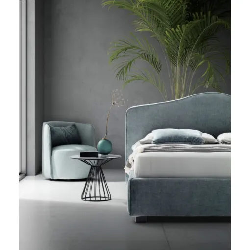 Upholstered fabric bed with a molded Pink headboard by Le Comfort