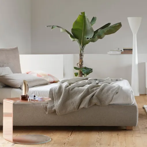 Upholstered bed in Softly fabric with a soft headboard by Calligaris.