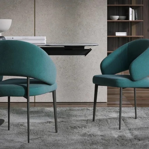 Astra chair in upholstered fabric by Tonin Casa.
