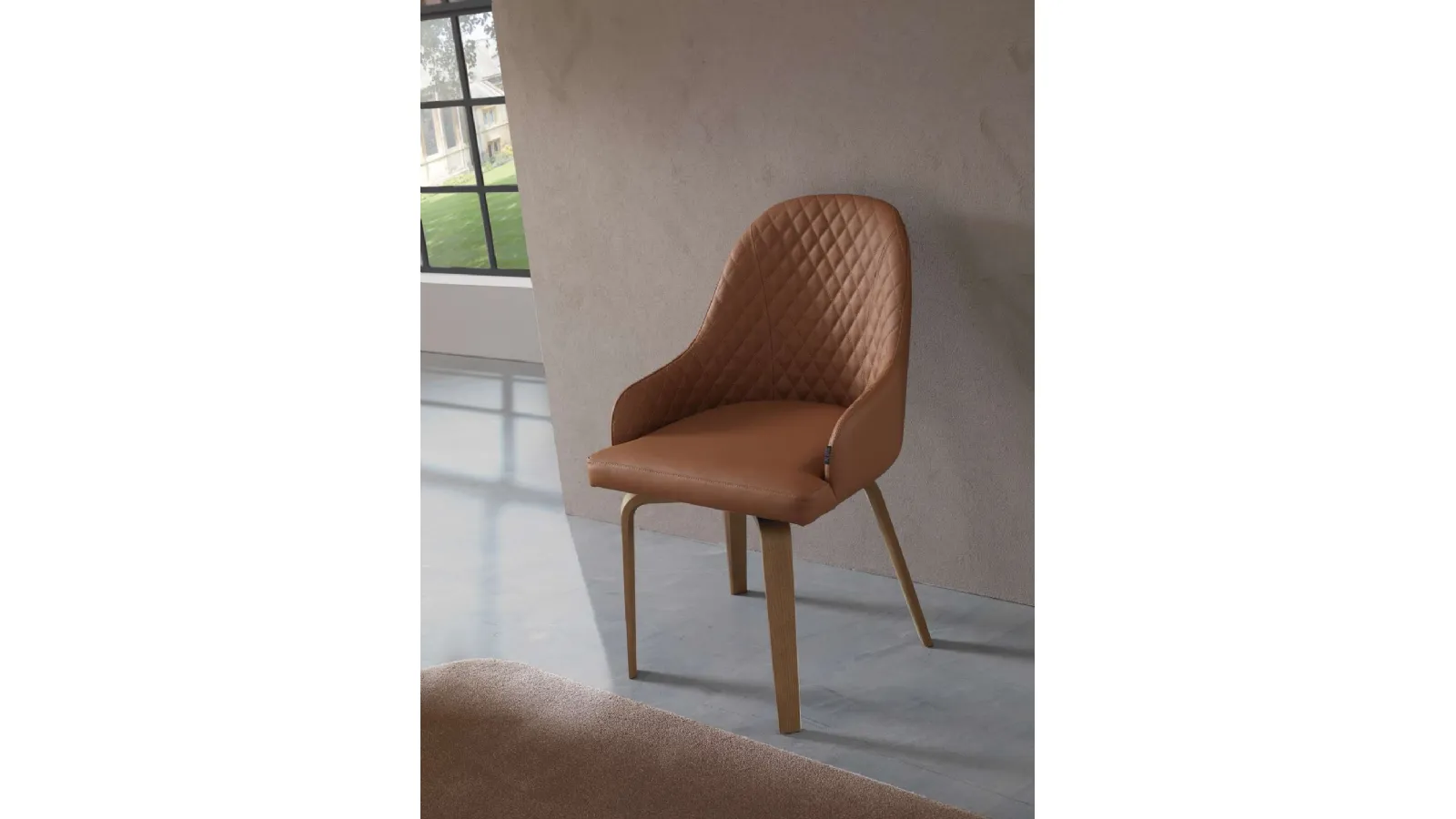 Athena leather chair with wooden legs by Ozzio.