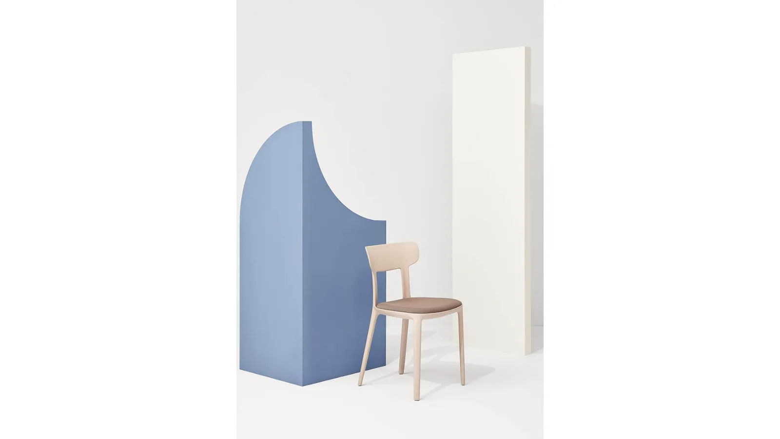 Canova chair in polypropylene with seat in padded fabric by Infiniti