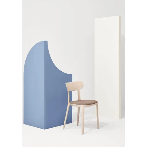 Canova chair in polypropylene with seat in padded fabric by Infiniti
