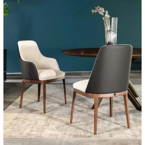 Chair with and without armrests Cleo in fabric with leather backrest by Tonin Casa.