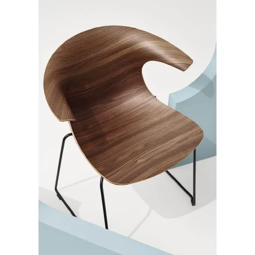 Loop 3D Wood Sled Chair with wooden shell and steel sled base by Infiniti.