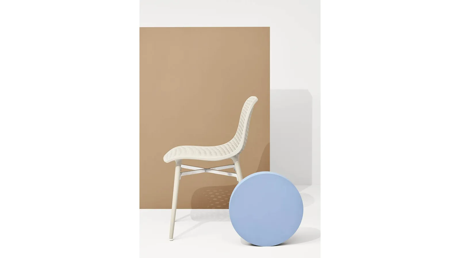 Next chair with perforated polyamide shell and solid Ash legs in Natural finish by Infiniti.