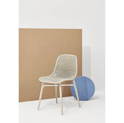 Next chair with perforated polyamide shell and solid Ash legs in Natural by Infiniti.