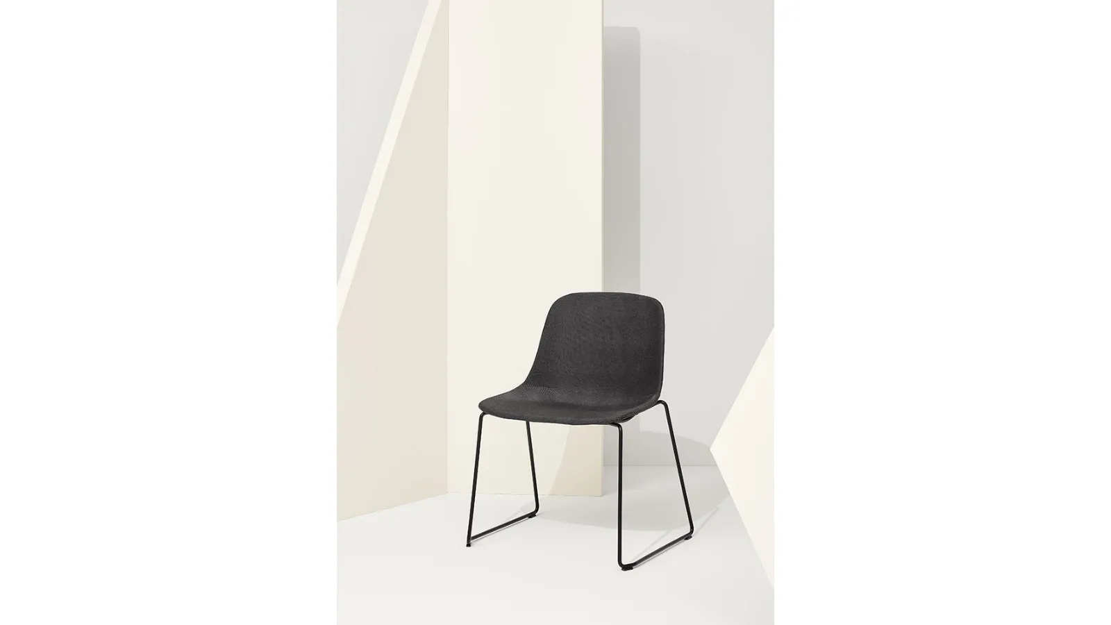 Pure Loop Maxi Sled chair with upholstered fabric shell and steel sled base by Infiniti.