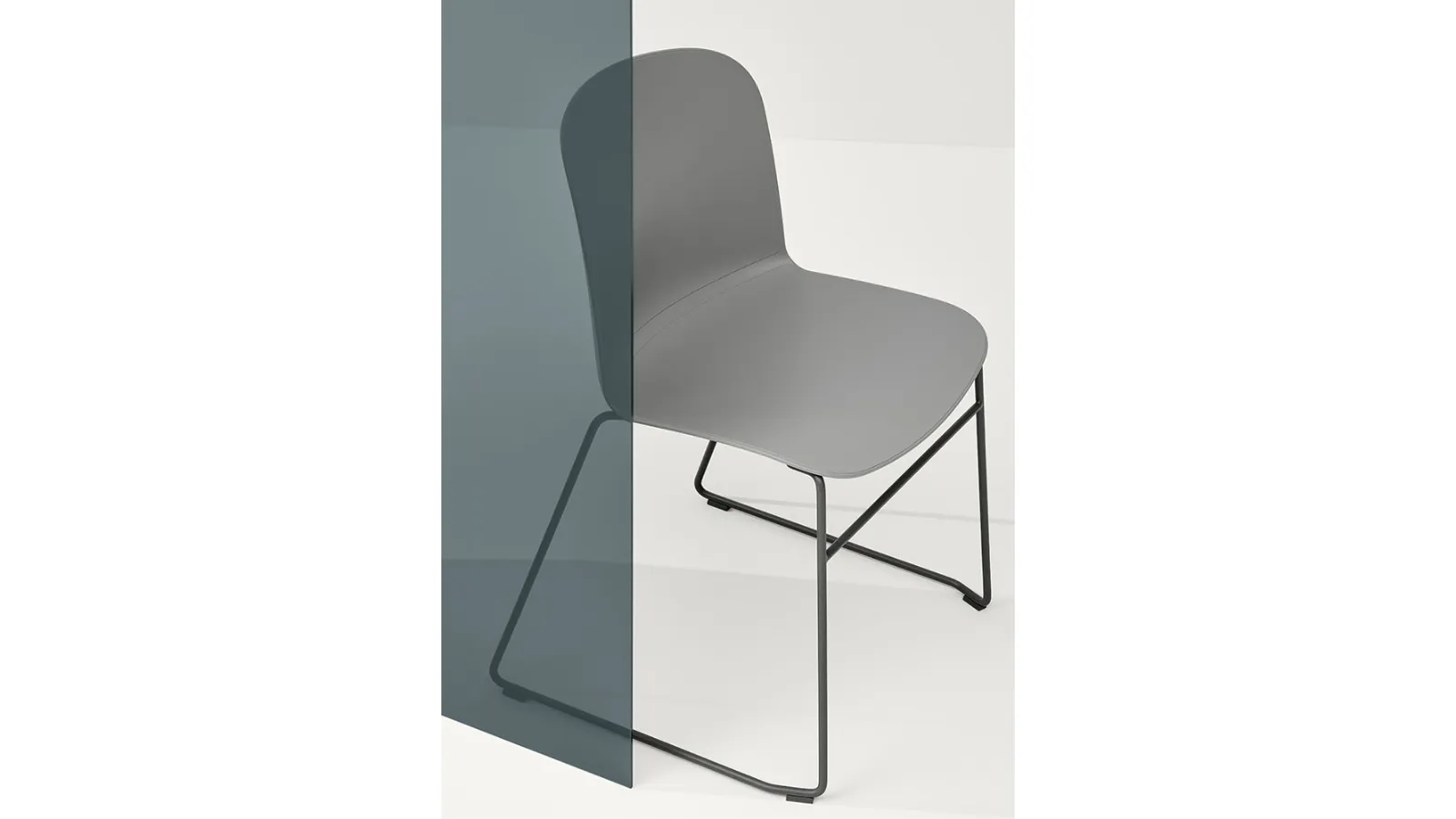 Relief Sled Chair in polypropylene with steel sled base by Infiniti.