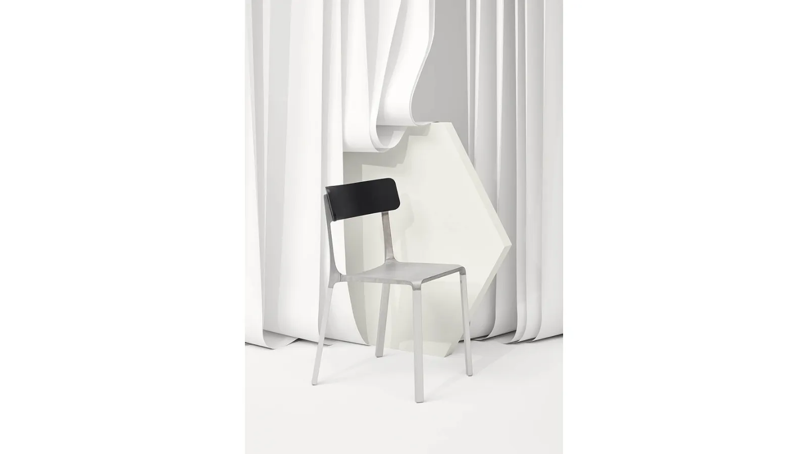 Ruelle chair in raw aluminum with backrest in Infiniti Oak.