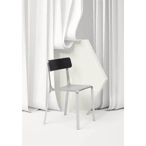 Ruelle chair in raw aluminum with backrest in Infiniti Oak.