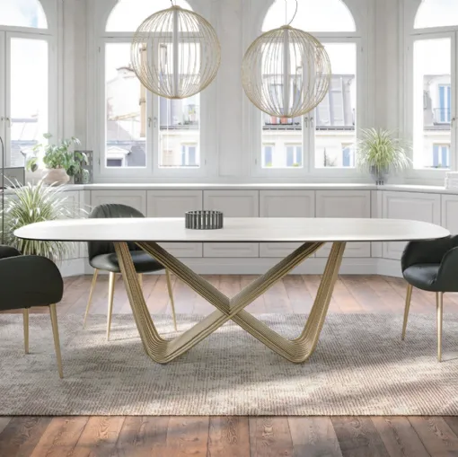 Tavolo Tenso with travertine sandstone top by Tonin Casa.