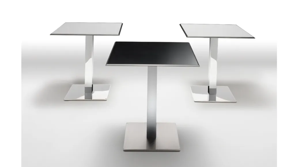 Plano Table with laminate top and chrome steel base by Infiniti.