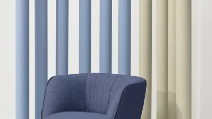 BomBom 4 Leg Armchair in padded fabric and steel legs by Infiniti.