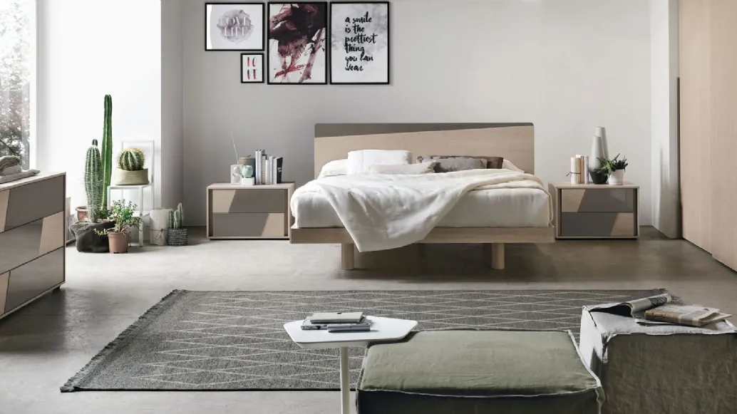 Bed made of sand oak material with a matte basalt material insert by Tomasella.