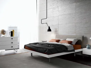 Bed with Duse headboard by Spagnol Mobili.