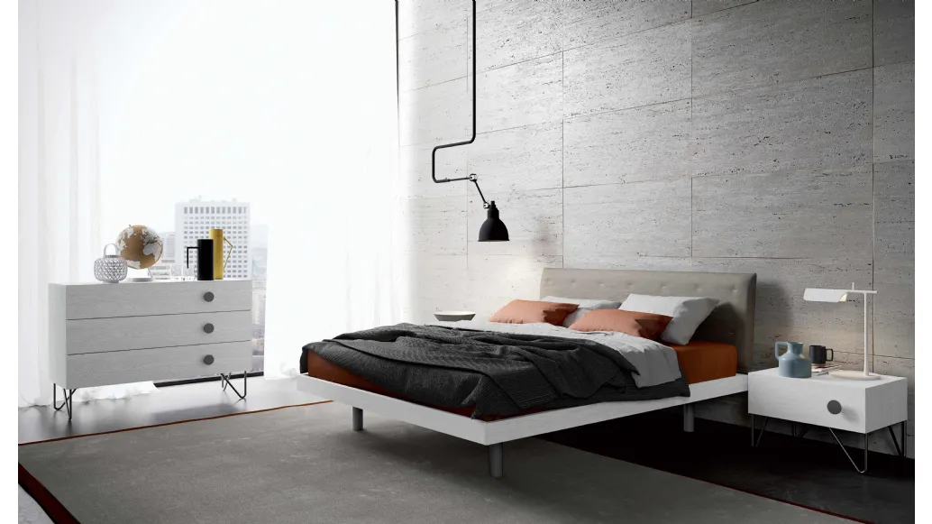 Bed with Duse headboard by Spagnol Mobili.