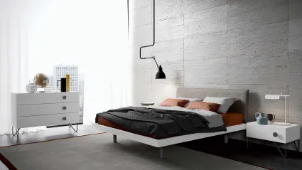 Bed with Duse headboard by Spagnol Mobili.