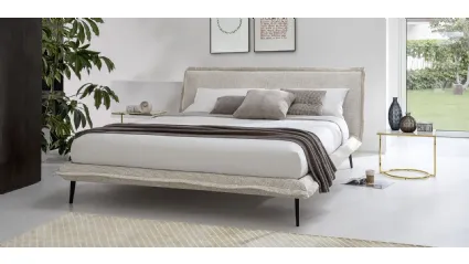 Upholstered fabric bed with metal feet Fluff by Calligaris.