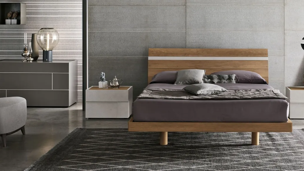Bed with light knotty materico headboard and cement Joker materico insert by Tomasella