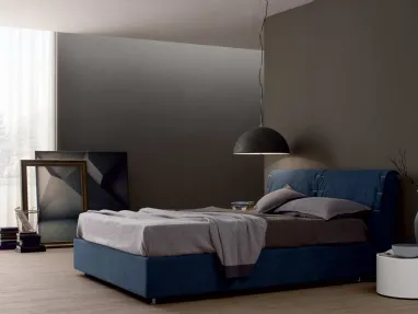 Upholstered bed with London headboard by Spagnol Mobili.