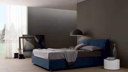 Upholstered bed with London headboard by Spagnol Mobili.
