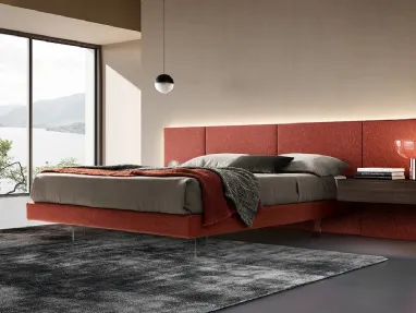 Modular bed in fabric with transparent feet by Adok.