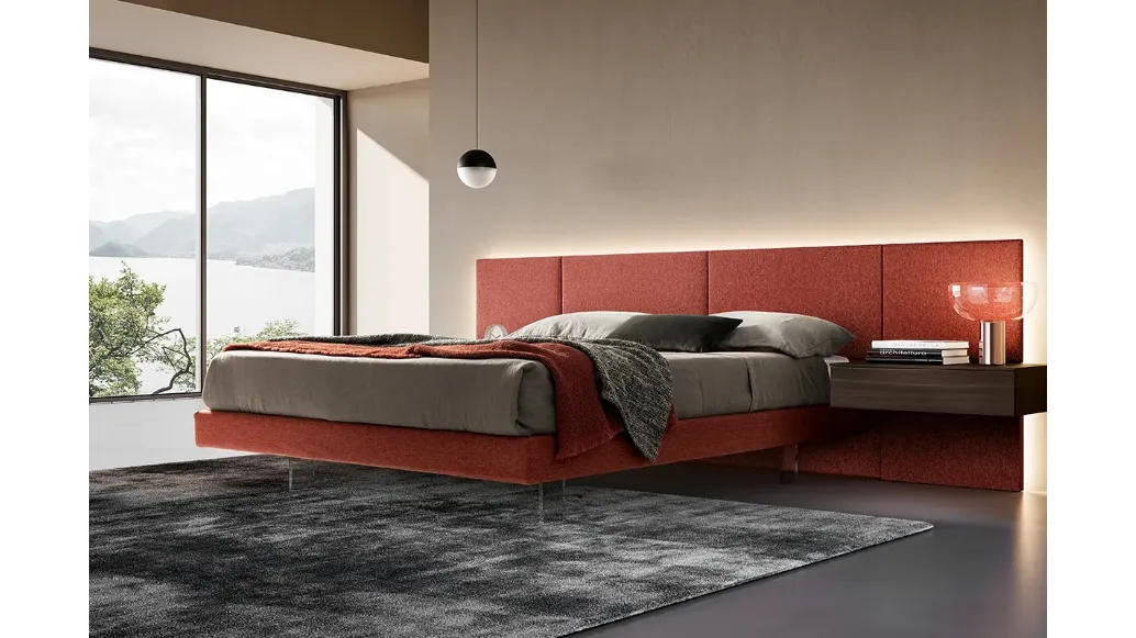 Modular bed in fabric with transparent feet by Adok.