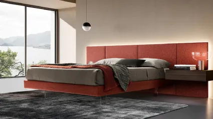 Modular bed in fabric with transparent feet by Adok.
