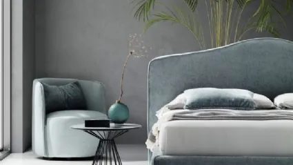 Upholstered fabric bed with a molded Pink headboard by Le Comfort