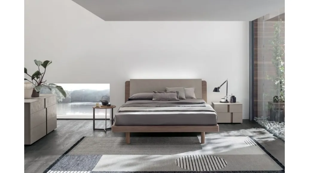 Bed in amber walnut materic and matte champagne materic with Roxy headboard by Tomasella.