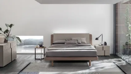 Bed in amber walnut materic and matte champagne materic with Roxy headboard by Tomasella.