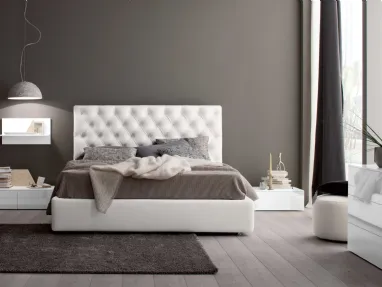 Leather bed with Royal capitonné headboard by Spagnol Mobili.