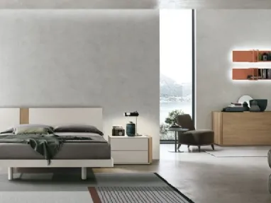 Bed made of jute material and amber walnut insert by Tomasella.