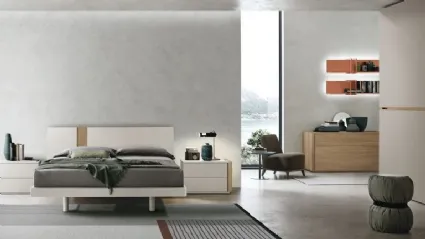 Bed made of jute material and amber walnut insert by Tomasella.