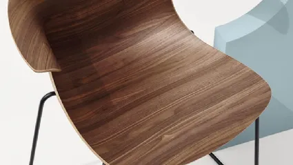 Loop 3D Wood Sled chair with wooden shell and sled base in steel by Infiniti.