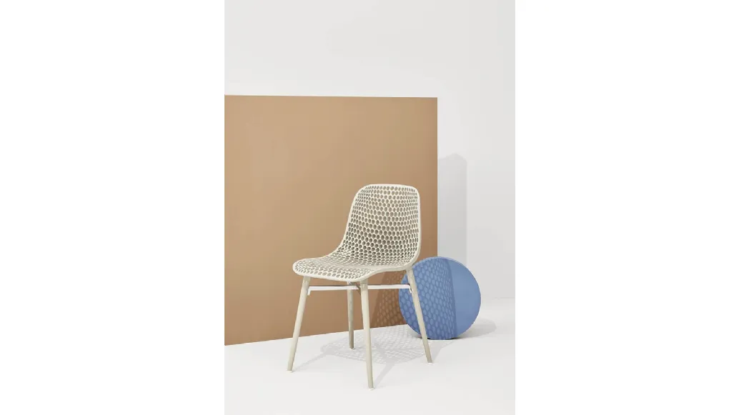 Next chair with perforated polyamide shell and legs in Natural solid Ash by Infiniti.