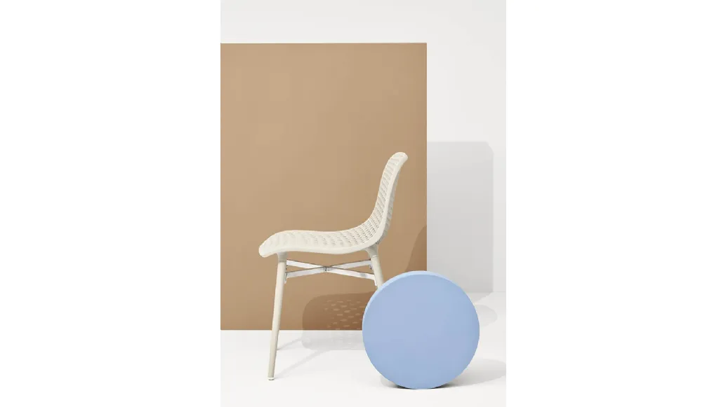 Next chair with perforated polyamide shell and solid Natural Ash legs by Infiniti.