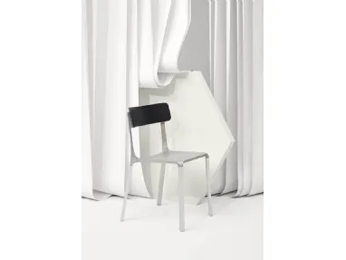 Raw aluminum Ruelle chair with oak backrest by Infiniti.