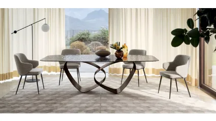 Breeze table with glass top and Calligaris sheet metal base.