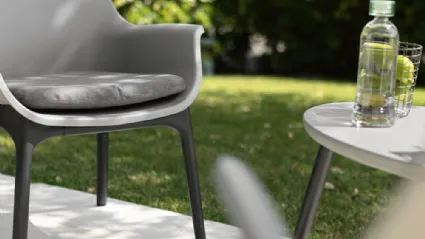 Lubecca armchair in polypropylene with padded fabric cushion by La Seggiola